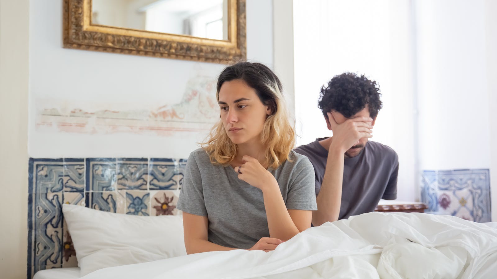 Erectile Dysfunction in Oregon: Common Causes and What Actually Helps Couple in bedroom looking tense