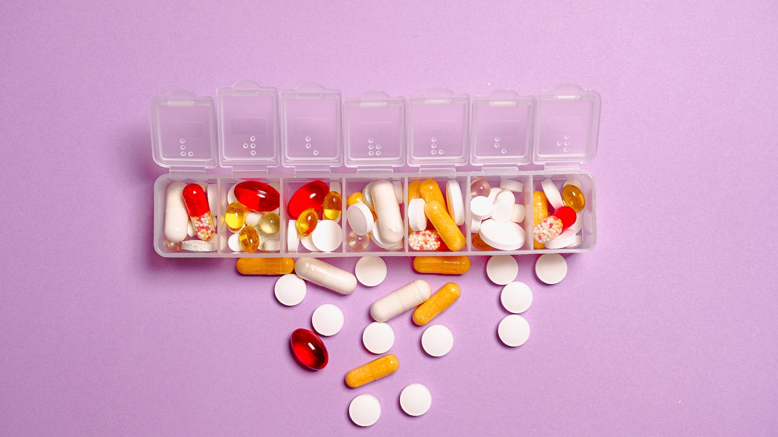 TRT Side Effects: What Is Common, What Is Not, and How to Manage Them Man examining vitamin supplements